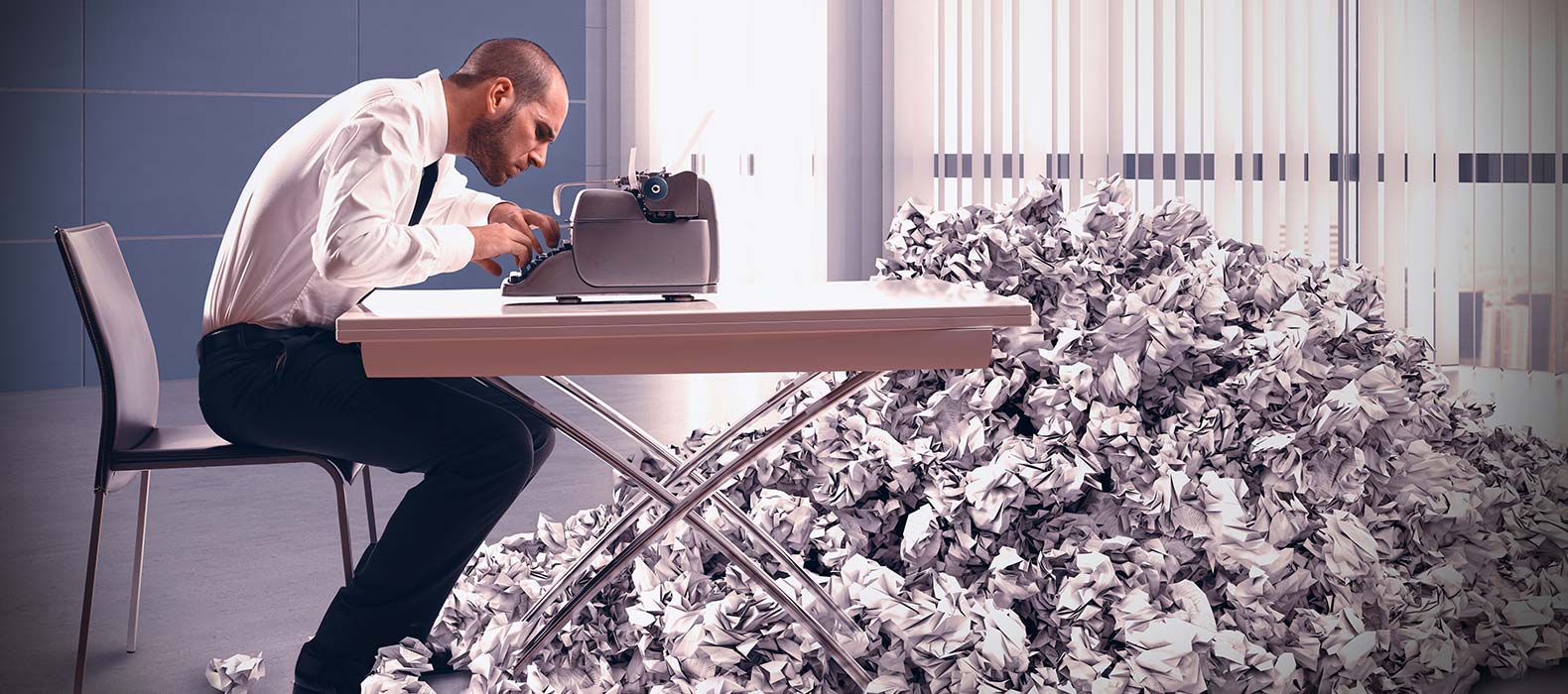 Employer Stressing Over Stacks of Paper on Floor